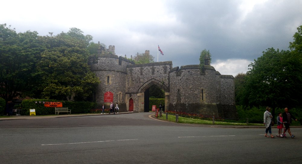 castle entrance flanked by trees