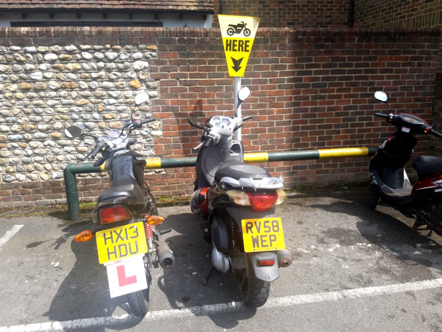scooter parked with other scooters